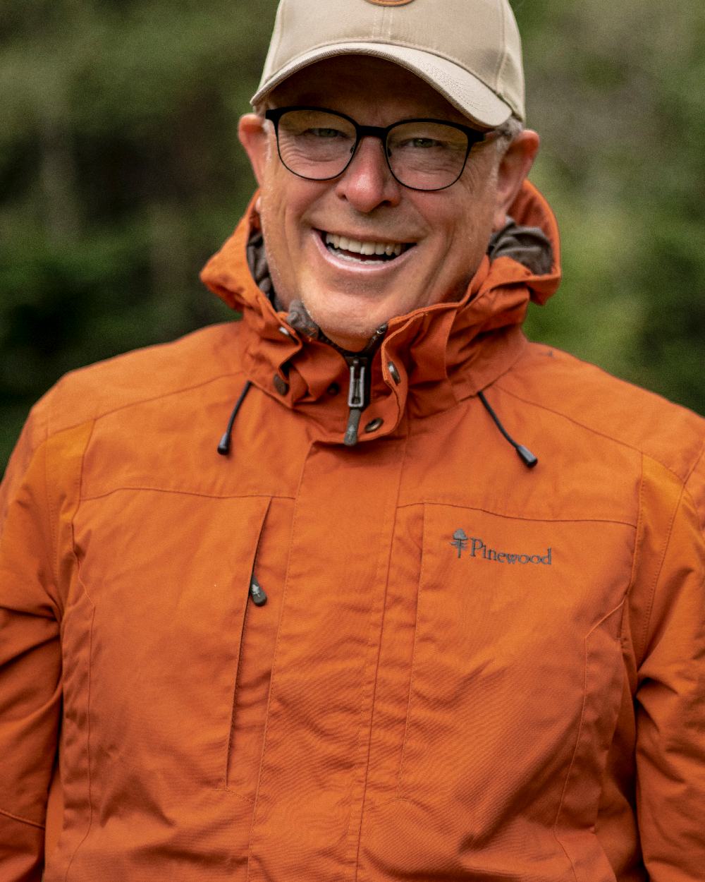 Burned Orange Coloured Pinewood Mens Dog Sports Trainer Jacket on outdoor background #colour_burned-orange