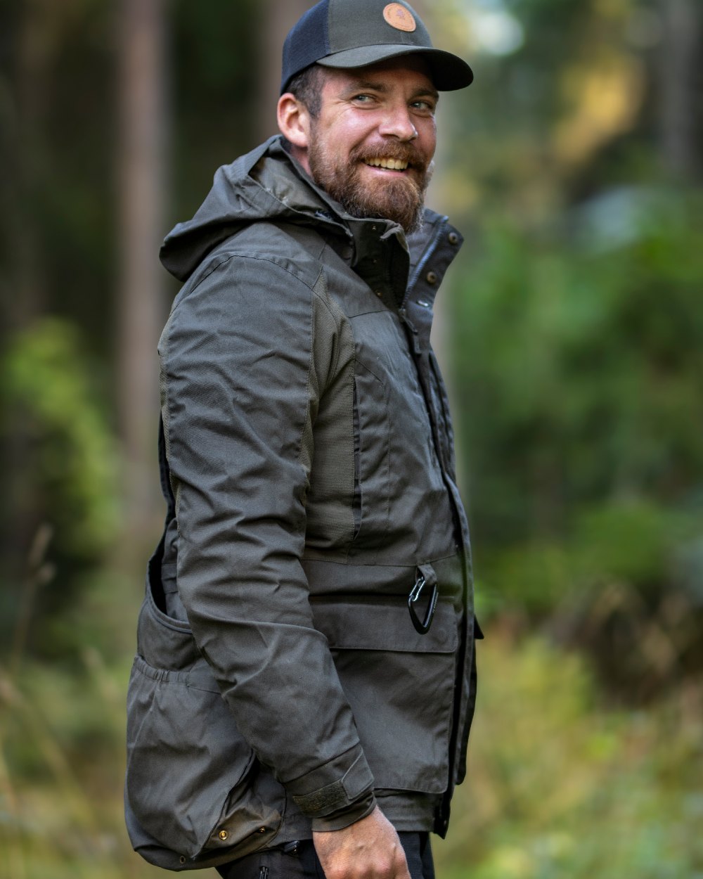 Moss Green Coloured Pinewood Mens Dog Sports Trainer Jacket on outdoor background #colour_moss-green