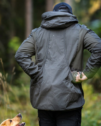 Moss Green Coloured Pinewood Mens Dog Sports Trainer Jacket on outdoor background #colour_moss-green