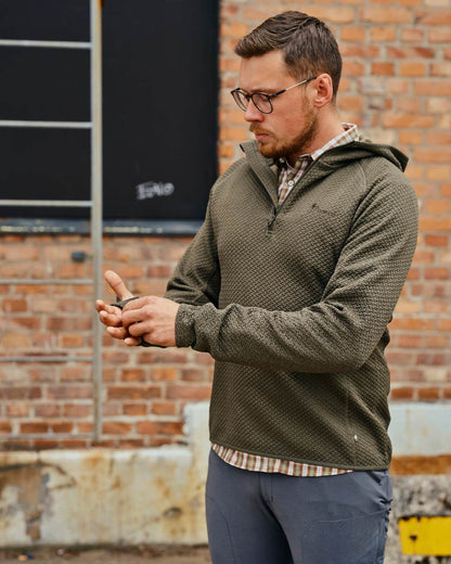 Dark Green Mel Coloured Pinewood Mens Everyday Travel Hoodie on outdoor background #colour_dark-green-mel