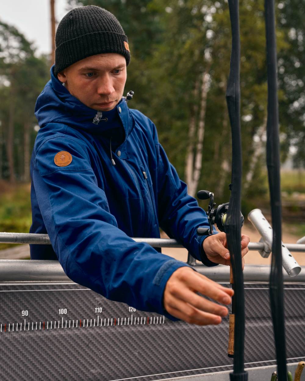 Dark Dive Coloured Pinewood Mens Finnveden Hybrid Extreme Jacket on forest background #colour_dark-dive