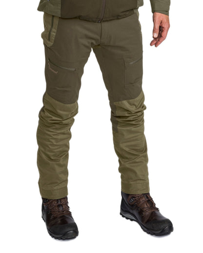 Dark Olive Hunting Olive Coloured Pinewood Mens Finnveden Hybrid Extreme Trousers on white background #colour_dark-olive-hunting-olive