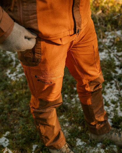 Fudge Nougat Coloured Pinewood Mens Finnveden Hybrid Extreme Trousers on forest background #colour_fudge-nougat