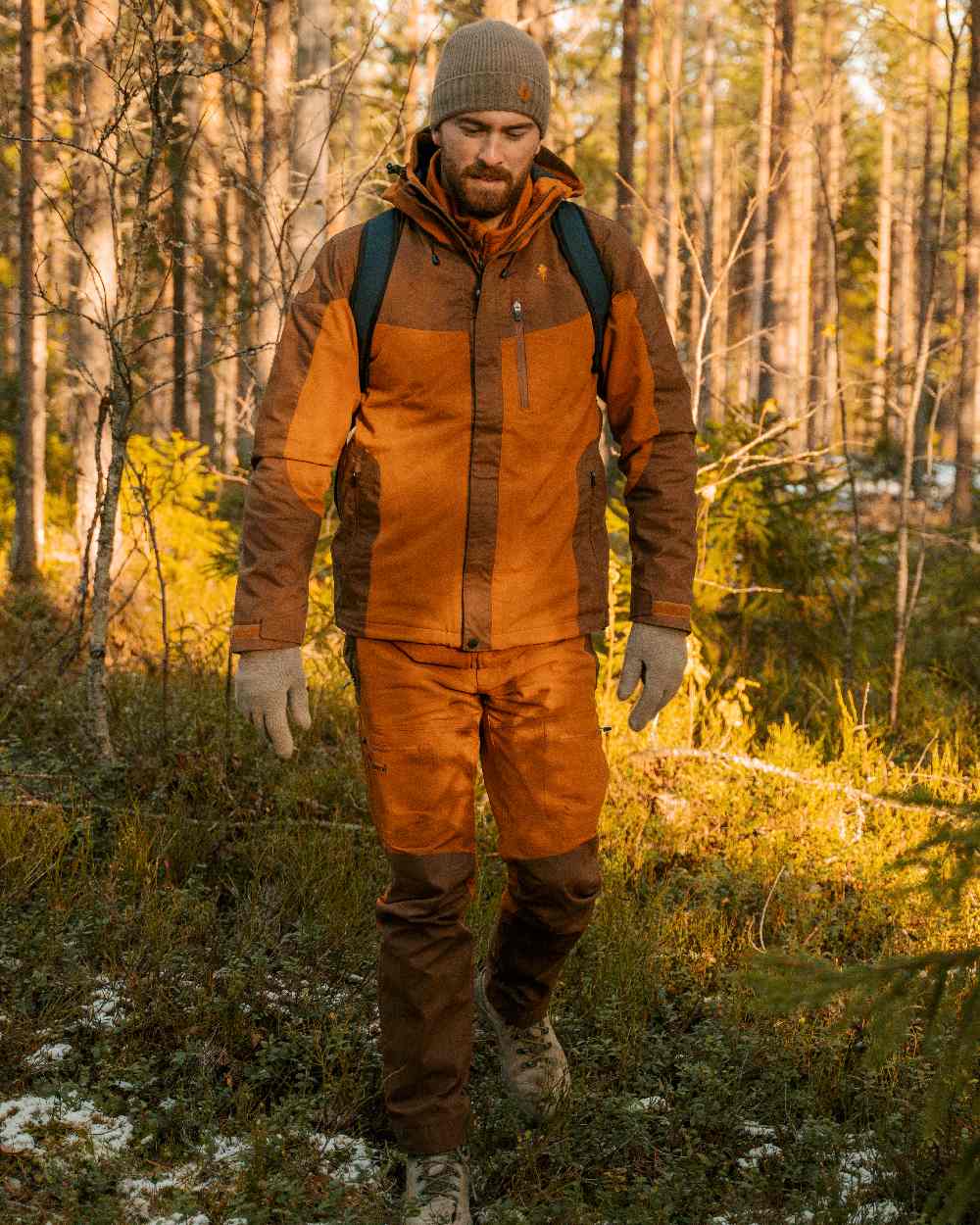 Fudge Nougat Coloured Pinewood Mens Finnveden Hybrid Extreme Trousers on forest background #colour_fudge-nougat