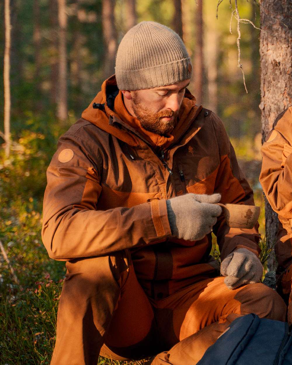 Fudge Nougat Coloured Pinewood Mens Finnveden Hybrid Extreme Trousers on forest background #colour_fudge-nougat