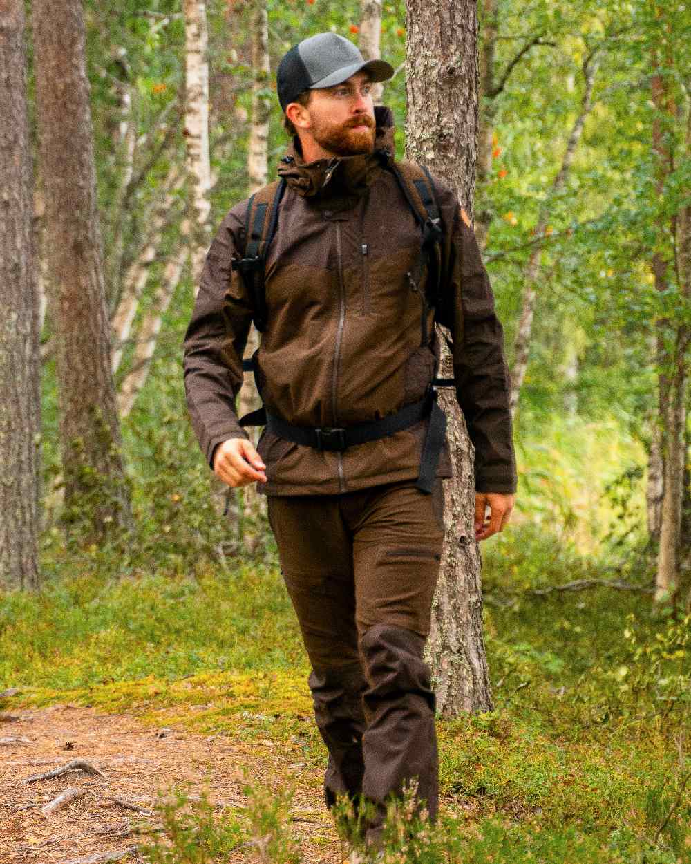 Dark Brown Coloured Pinewood Mens Finnveden Hybrid Jacket on outdoor background #colour_dark-brown
