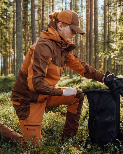 Fudge Nougat Coloured Pinewood Mens Finnveden Hybrid Jacket on outdoor background #colour_fudge-nougat
