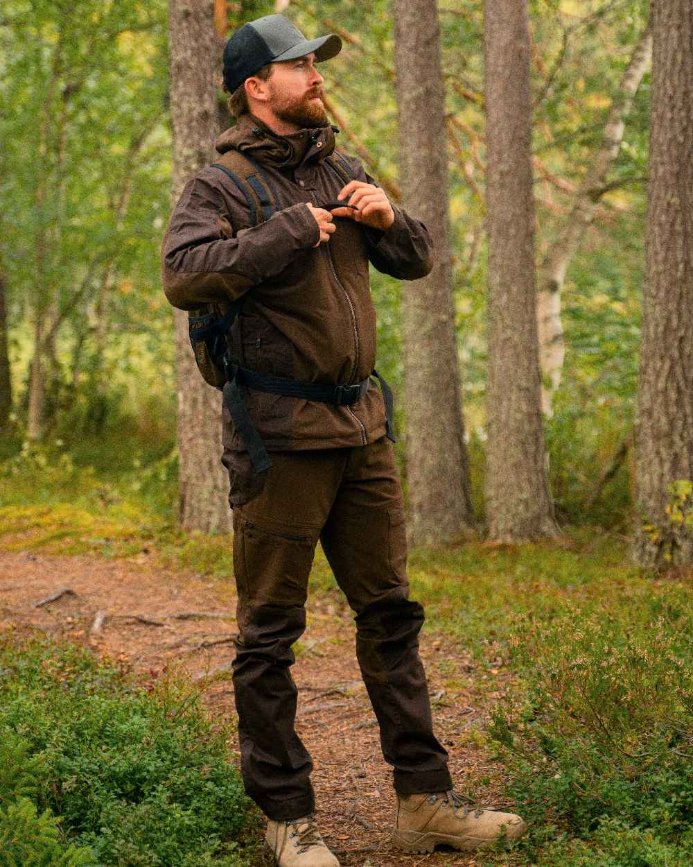 Dark Brown Coloured Pinewood Mens Finnveden Hybrid Trousers on outdoor background #colour_dark-brown