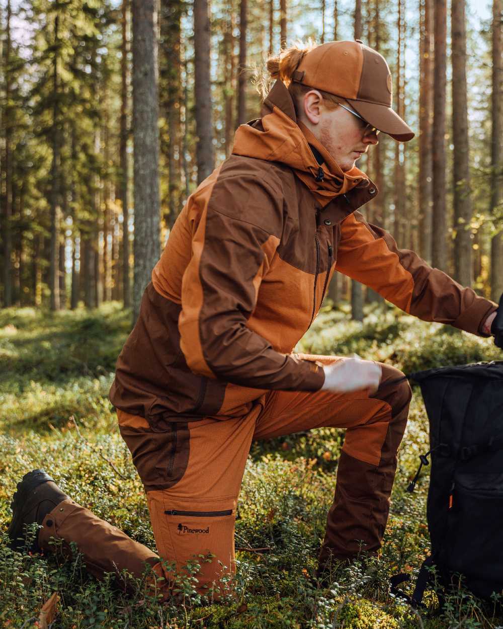 Fudge Nougat Coloured Pinewood Mens Finnveden Hybrid Trousers on outdoor background #colour_fudge-nougat
