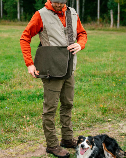 Hunting Olive Coloured Pinewood Mens Finnveden Hybrid Trousers on outdoor background #colour_hunting-olive