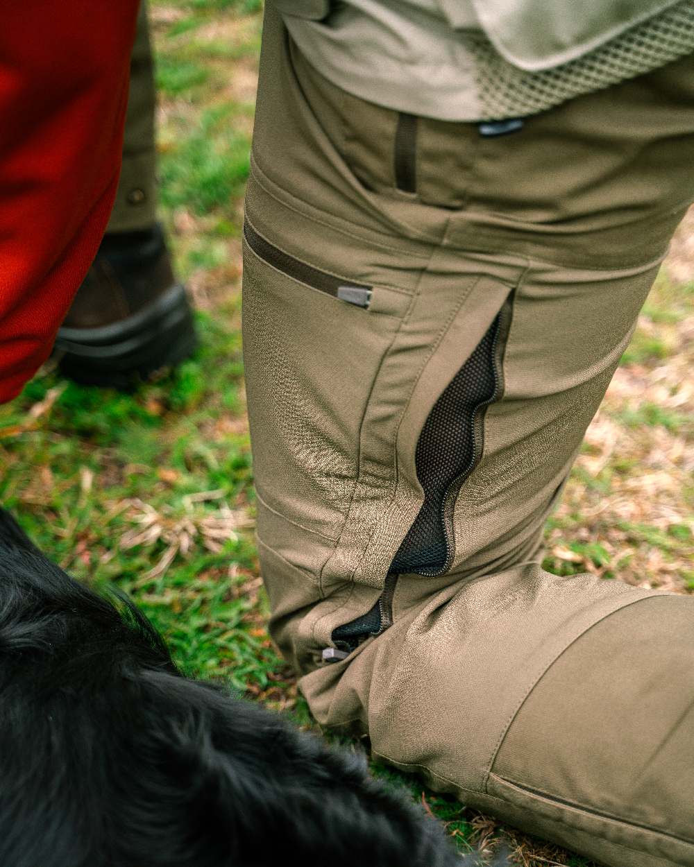 Hunting Olive Coloured Pinewood Mens Finnveden Hybrid Trousers on outdoor background #colour_hunting-olive