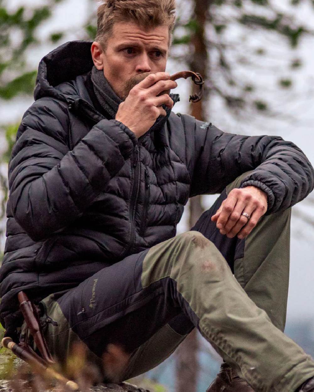 Mid Green Dark Anthracite coloured Pinewood Mens Finnveden Hybrid Trousers on forest background #colour_mid-green-dark-anthracite