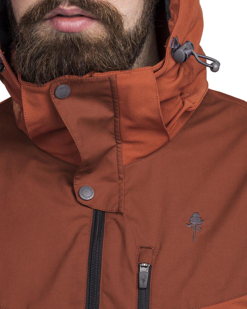 Terracotta coloured Pinewood Mens Finnveden Hybrid Jacket on white background #colour_terracotta