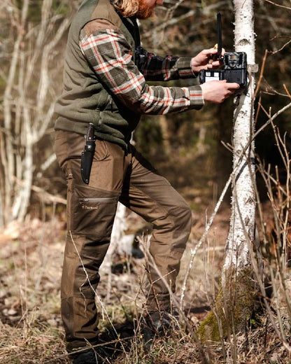 Hunting Brown Suede Brown Coloured Pinewood Mens Furudal Retriever Active Hunting Trousers on outdoor background #colour_hunting-brown-suede-brown