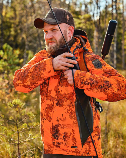 Strata Blaze Coloured Pinewood Mens Hunter Pro Xtreme 2.0 Camou Jacket on forest background #colour_strata-blaze
