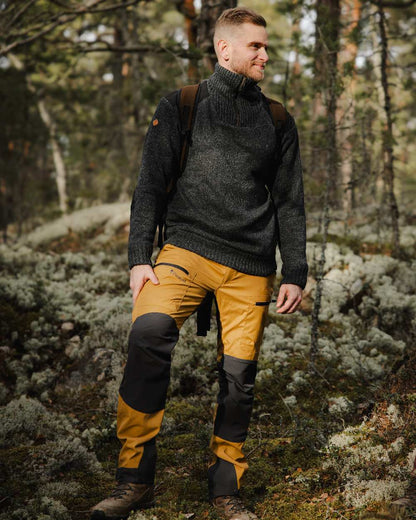 Dark Grey Mel Coloured Pinewood Mens Hurricane Sweater on outdoor background #colour_dark-grey-mel