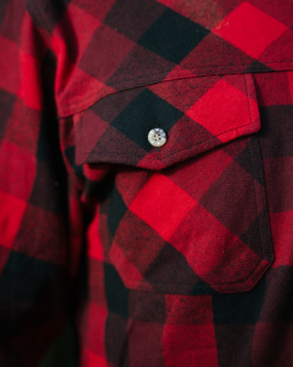 Red Black coloured Pinewood Mens Lumbo Shirt on forest background #colour_red-black