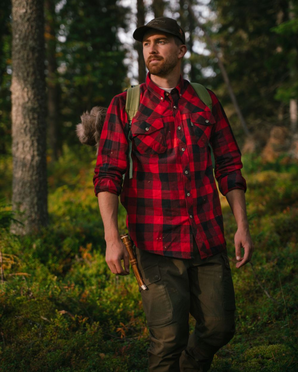 Red Black coloured Pinewood Mens Lumbo Shirt on forest background #colour_red-black