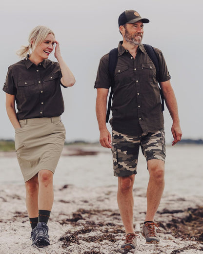 Dark Olive Coloured Pinewood Mens Safari Short Sleeve Shirt on outdoor background #colour_dark-olive