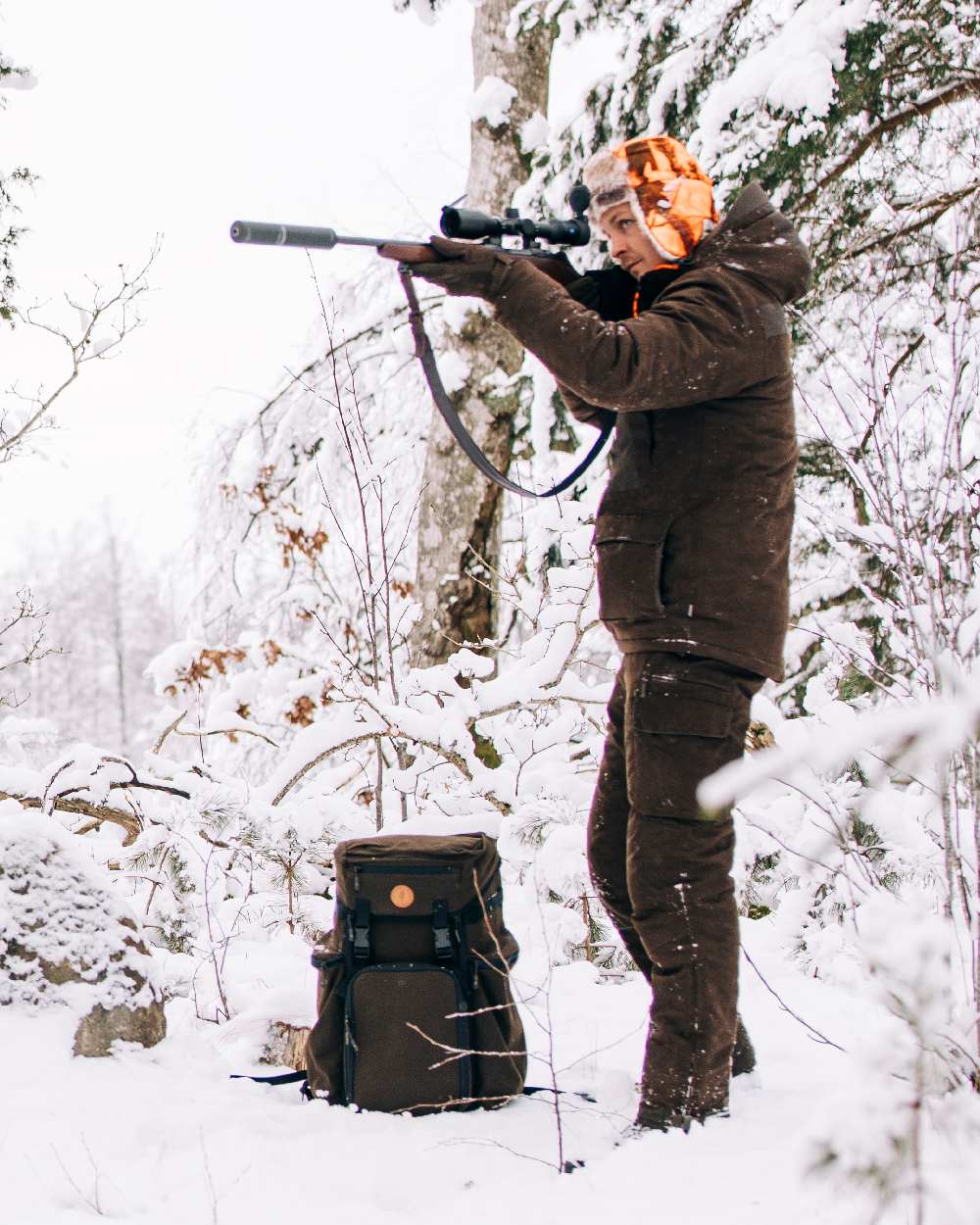 Suede Brown Coloured Pinewood Mens Smaland Abisko 2.0 Hunting Jacket on snow background #colour_suede-brown