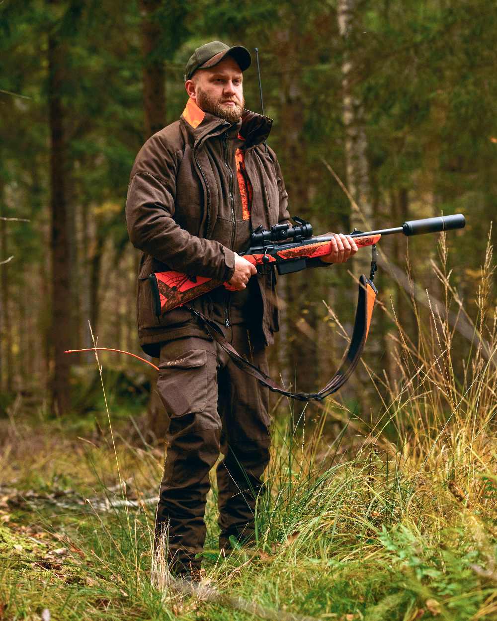 Suede Brown Coloured Pinewood Mens Smaland Hunters Jacket on forest background #colour_suede-brown