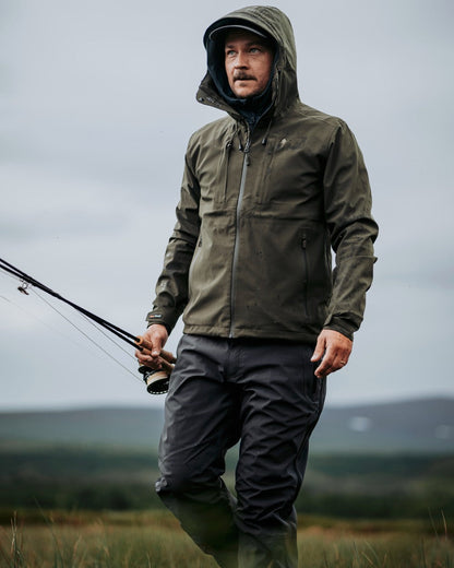 Dark Anthracite Coloured Pinewood Mens Telluz Trousers on forest background #colour_dark-anthracite