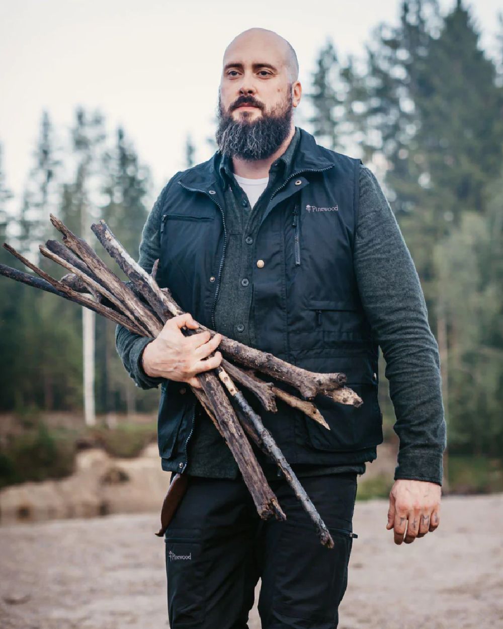 Black coloured Pinewood Mens Tiveden Vest on forest background #colour_black