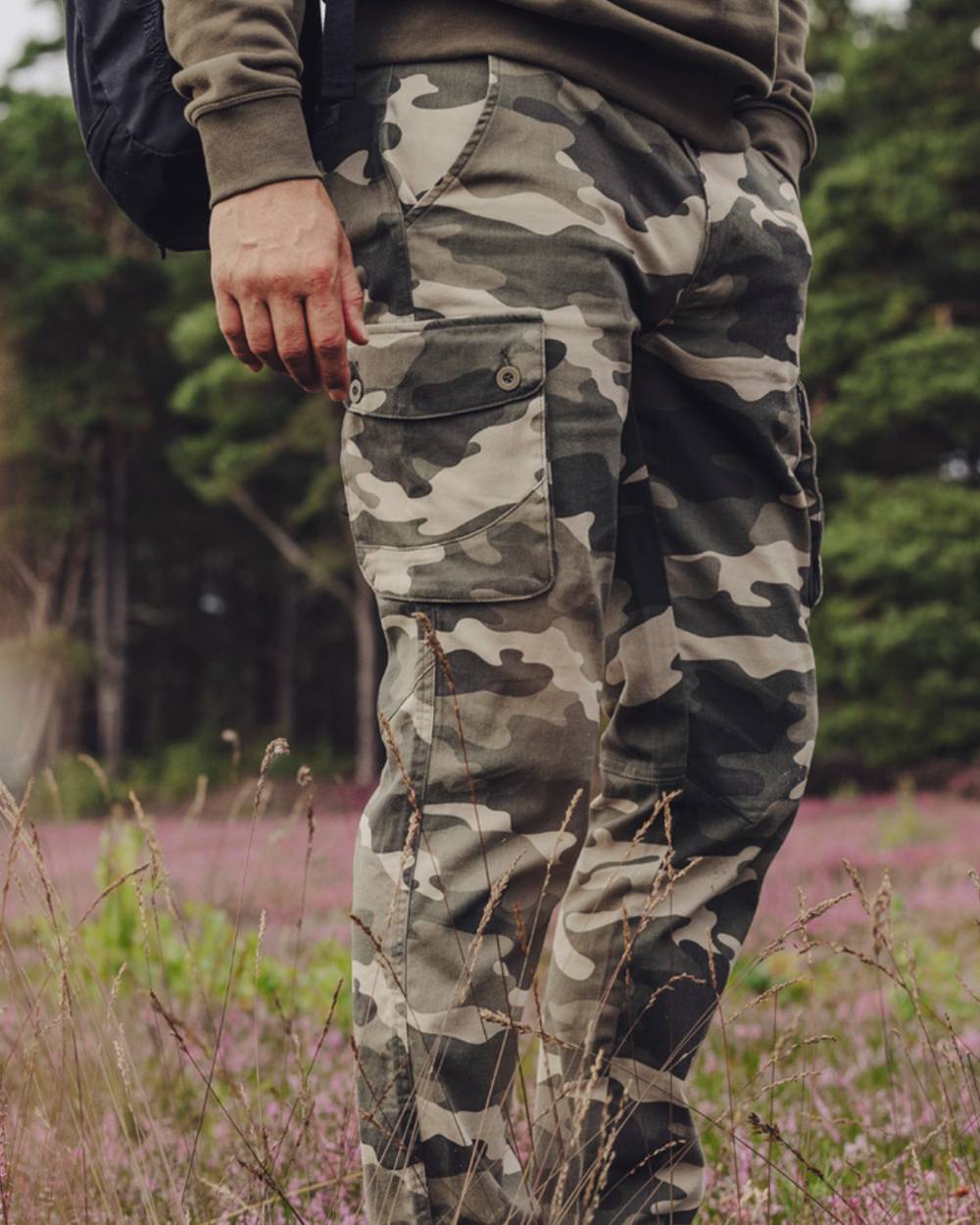 Khaki Camouflage Coloured Pinewood Mens Värnamo Serengeti Trousers on forest background #colour_khaki-camouflage