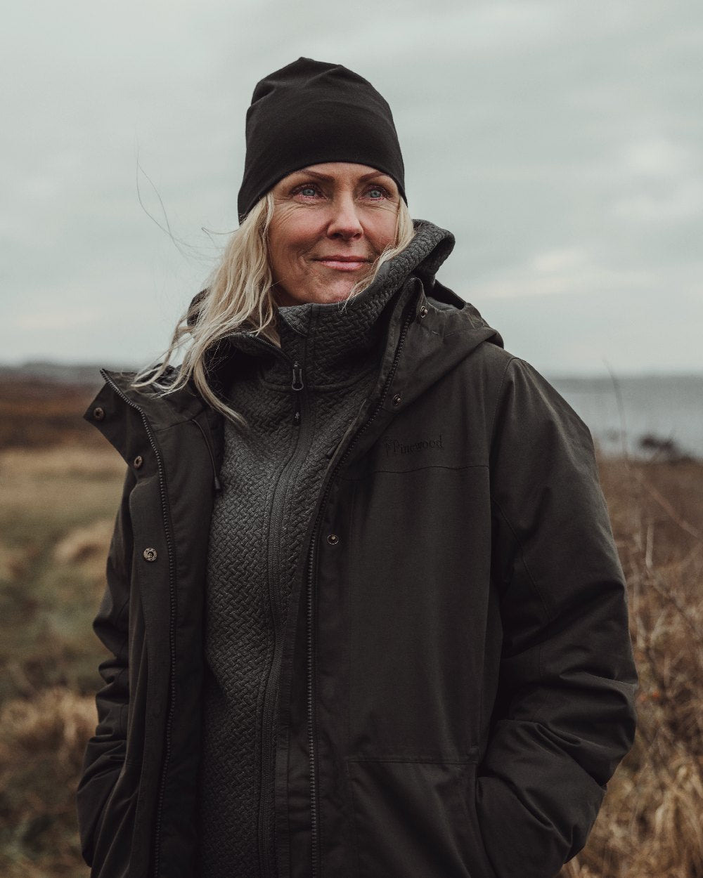 Black Coloured Pinewood Merino Wool Beanie on outdoor background #colour_black