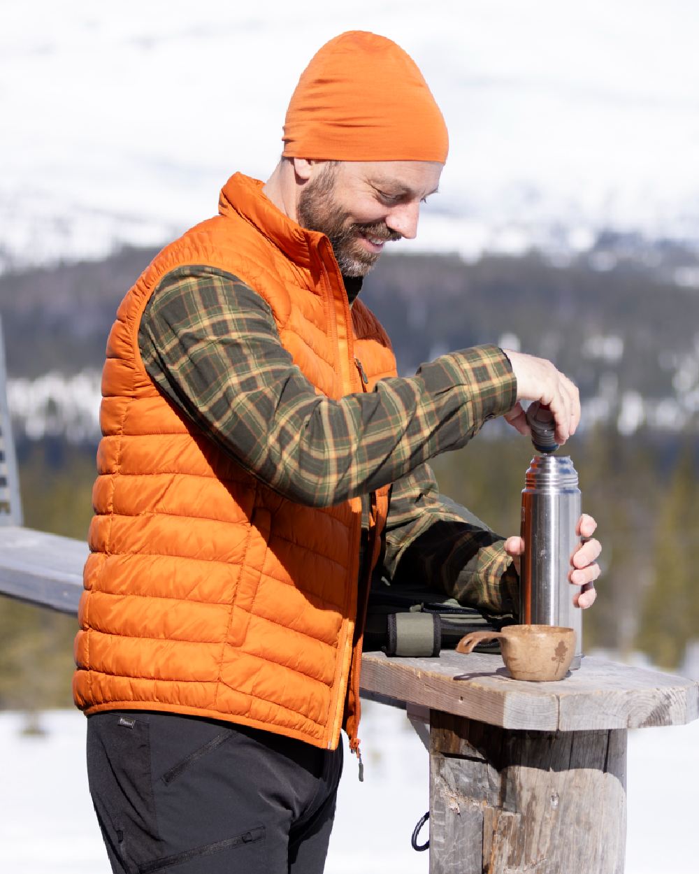 Burned Orange Coloured Pinewood Merino Wool Beanie on outdoor background #colour_burned-orange