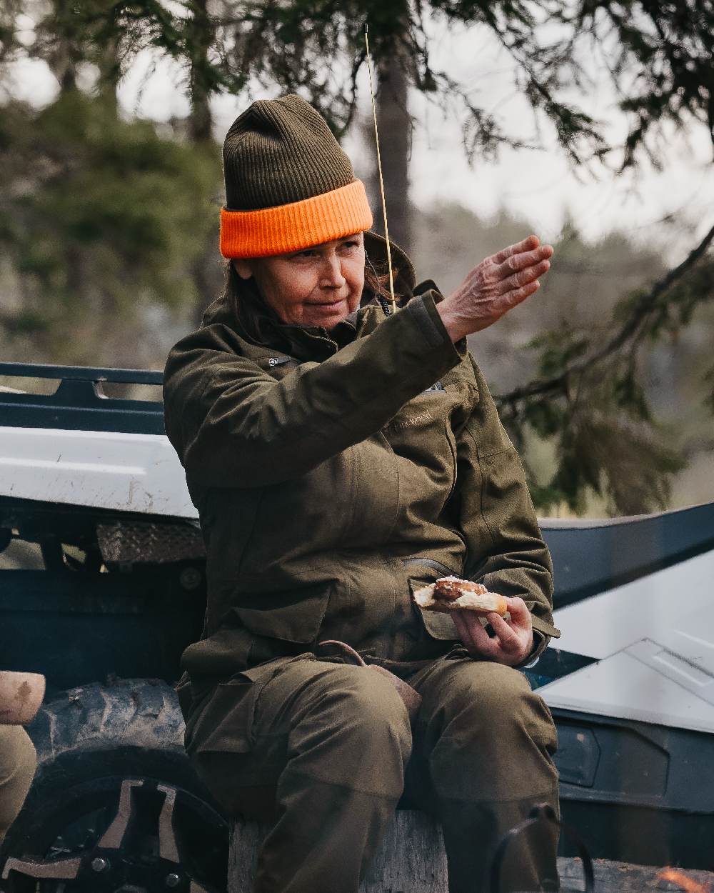 Mossgreen Orange Coloured Pinewood Smaland Reversible Hunters Hat on outdoor background #colour_mossgreen-orange