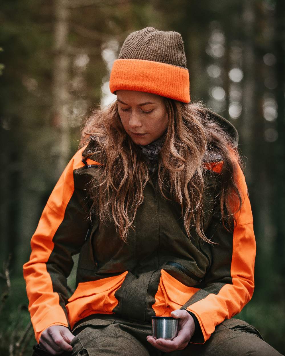 Mossgreen Orange Coloured Pinewood Smaland Reversible Hunters Hat on outdoor background #colour_mossgreen-orange