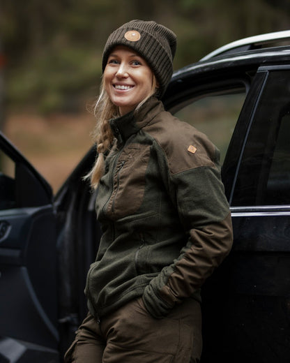 Moss Green Coloured Pinewood Windy Hat on outdoor background #colour_moss-green