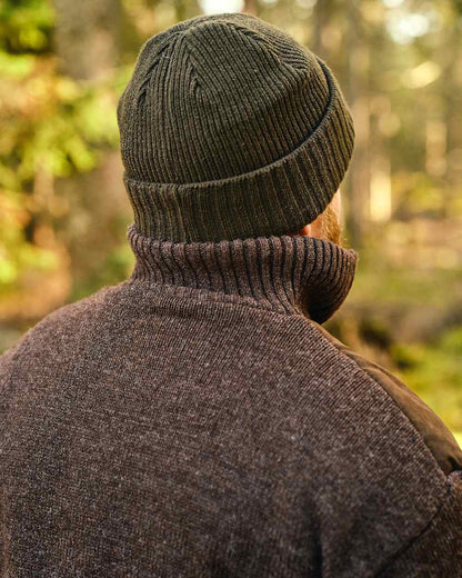 Moss Green Coloured Pinewood Windy Hat on outdoor background #colour_moss-green