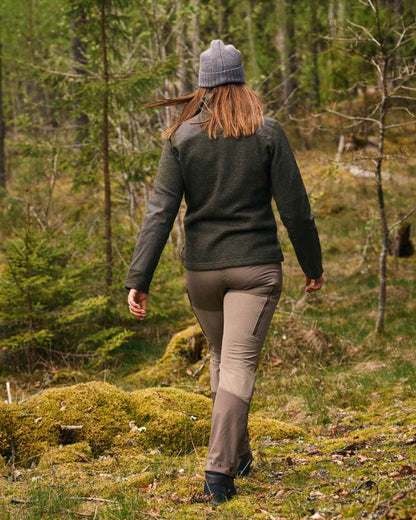 Mole Brown Coloured Pinewood Womens Abisko Brenton Trousers on forest background #colour_mole-brown
