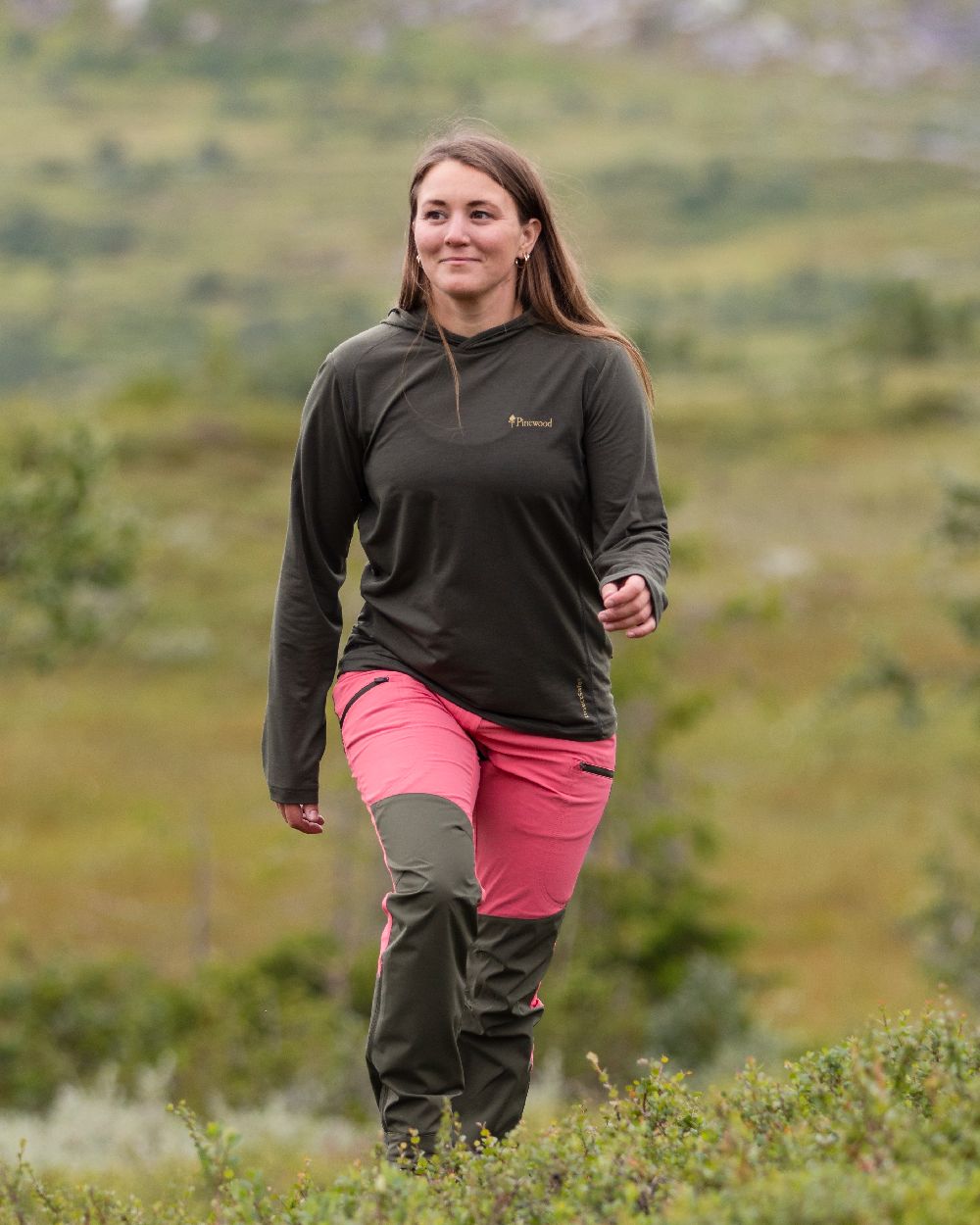 Pink Blush Mossgreen Coloured Pinewood Womens Abisko Brenton Trousers on forest background #colour_pink-blush-mossgreen