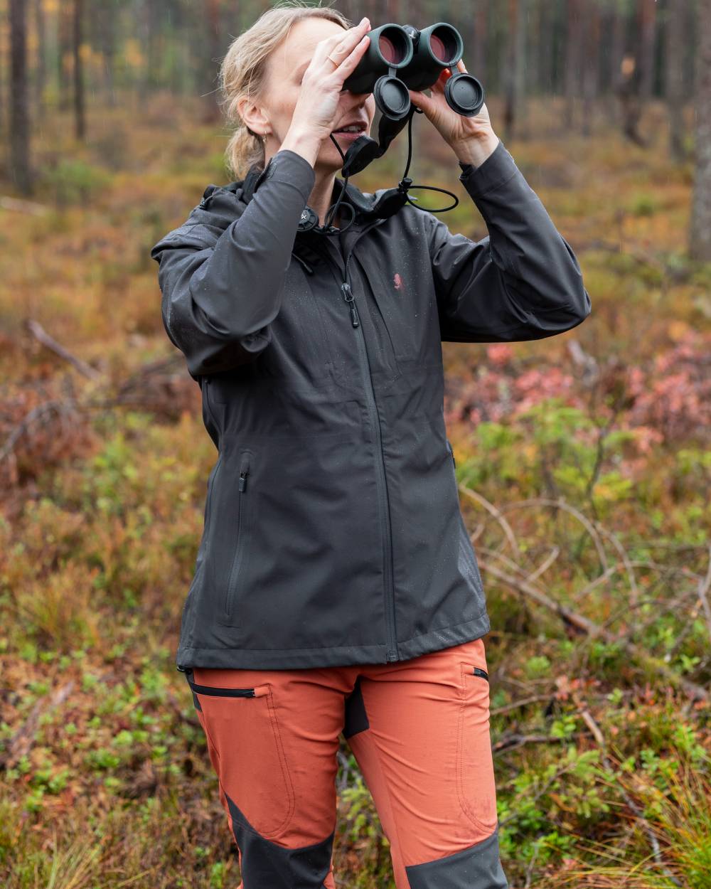 Terracotta Dark Anthracite Coloured Pinewood Womens Abisko Brenton Trousers on forest background #colour_terracotta-dark-anthracite