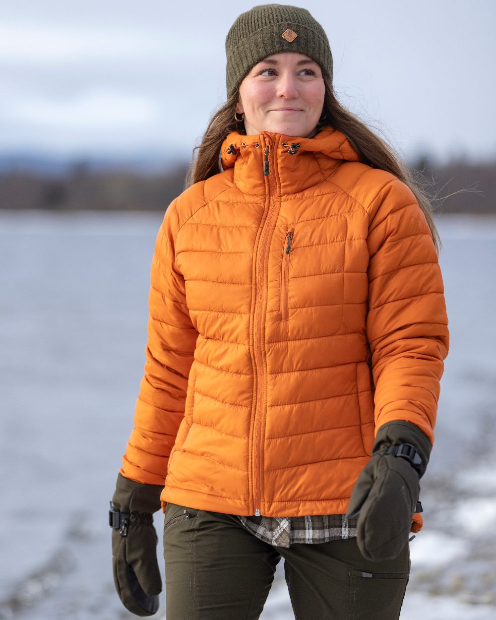 Burned Orange Coloured Pinewood Womens Abisko Insulation Jacket on snow background #colour_burned-orange