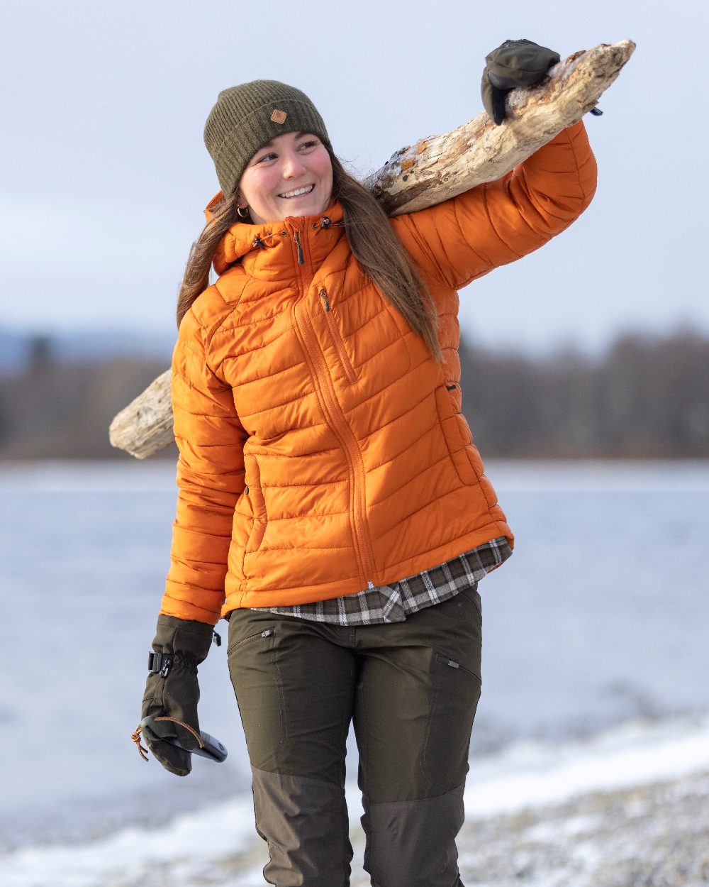 Burned Orange Coloured Pinewood Womens Abisko Insulation Jacket on snow background #colour_burned-orange