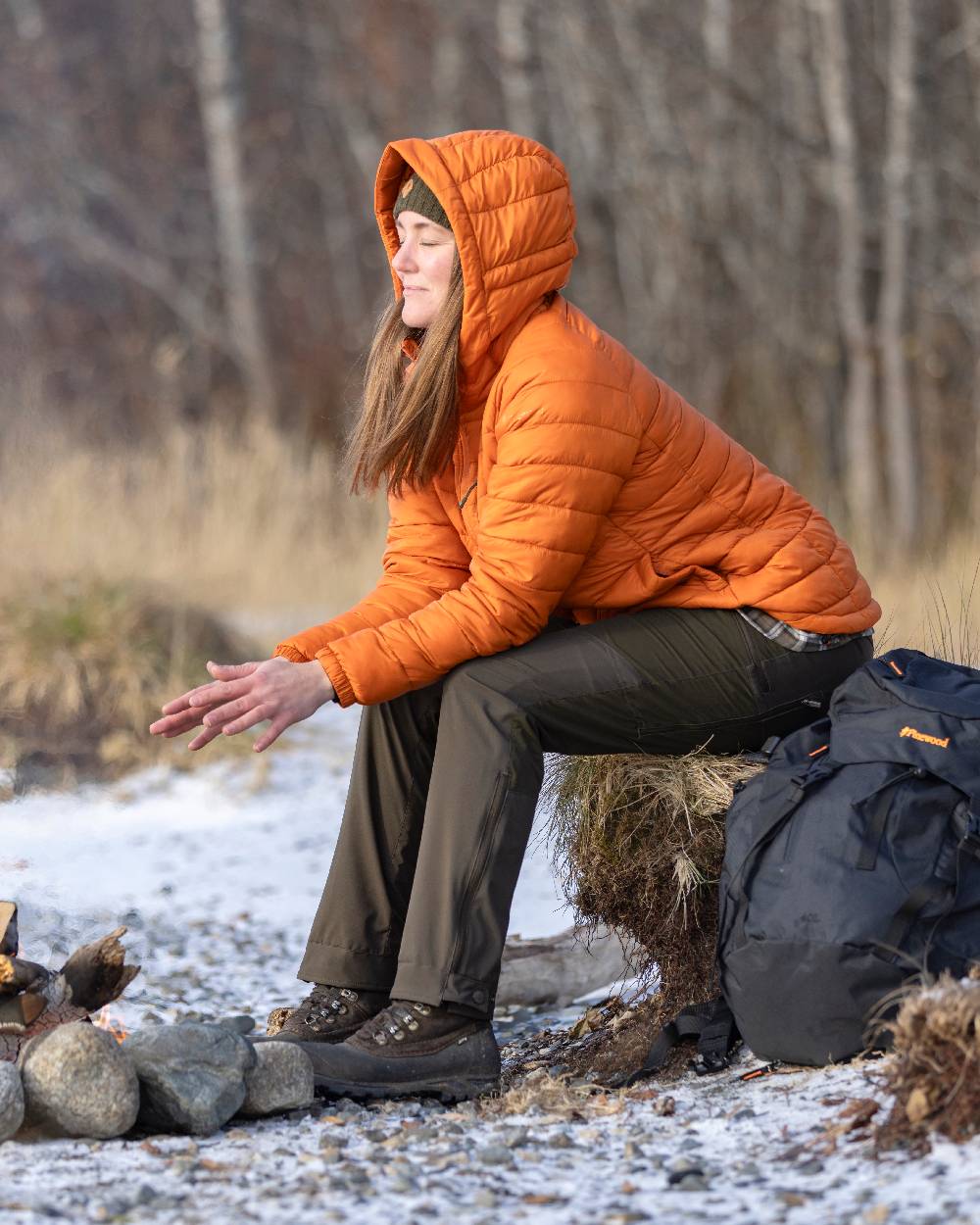Burned Orange Coloured Pinewood Womens Abisko Insulation Jacket on snow background #colour_burned-orange