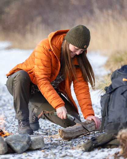 Burned Orange Coloured Pinewood Womens Abisko Insulation Jacket on snow background #colour_burned-orange