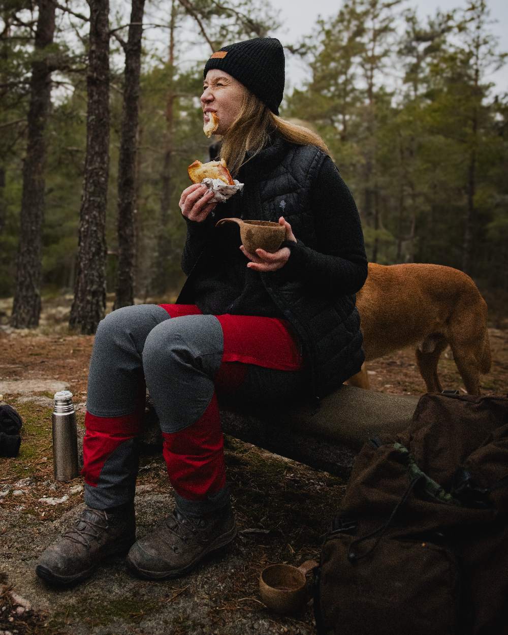 Black Coloured Pinewood Womens Abisko Insulation Vest on forest background #colour_black