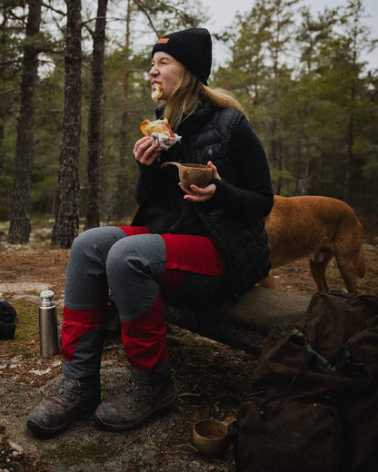 Black Coloured Pinewood Womens Abisko Insulation Vest on forest background #colour_black