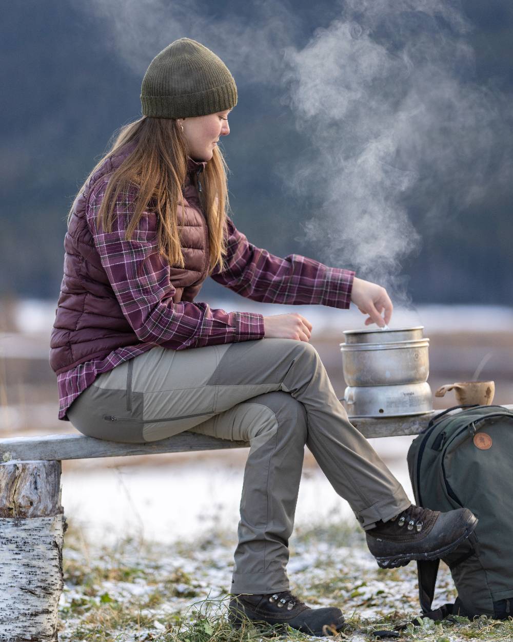 Earth Plum Coloured Pinewood Womens Abisko Insulation Vest on outdoor background #colour_earth-plum