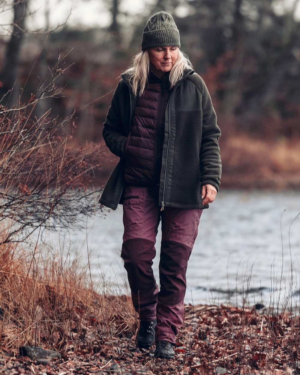 Earth Plum Coloured Pinewood Womens Abisko Insulation Vest on outdoor background #colour_earth-plum