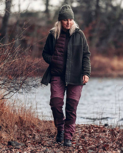 Earth Plum Coloured Pinewood Womens Abisko Insulation Vest on outdoor background #colour_earth-plum