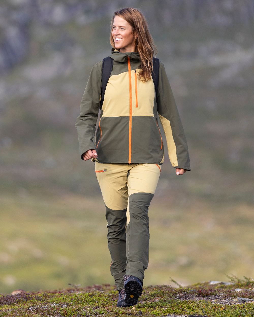Golden Hay Mossgreen Coloured Pinewood Womens Abisko Light Stretch Jacket on outdoor background #colour_golden-hay-mossgreen