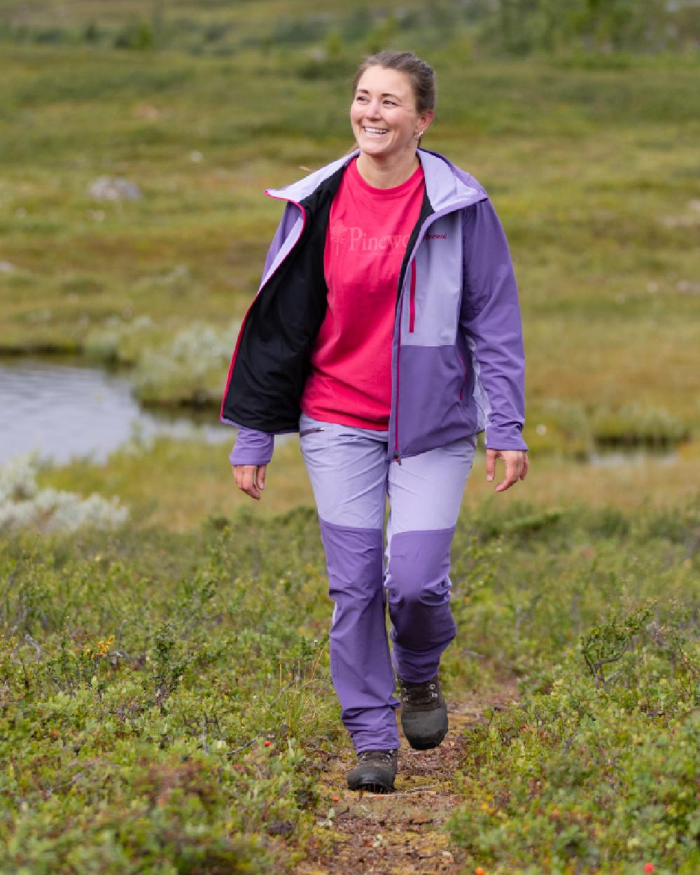 Light Lilac Coloured Pinewood Womens Abisko Light Stretch Jacket on outdoor background #colour_light-lilac