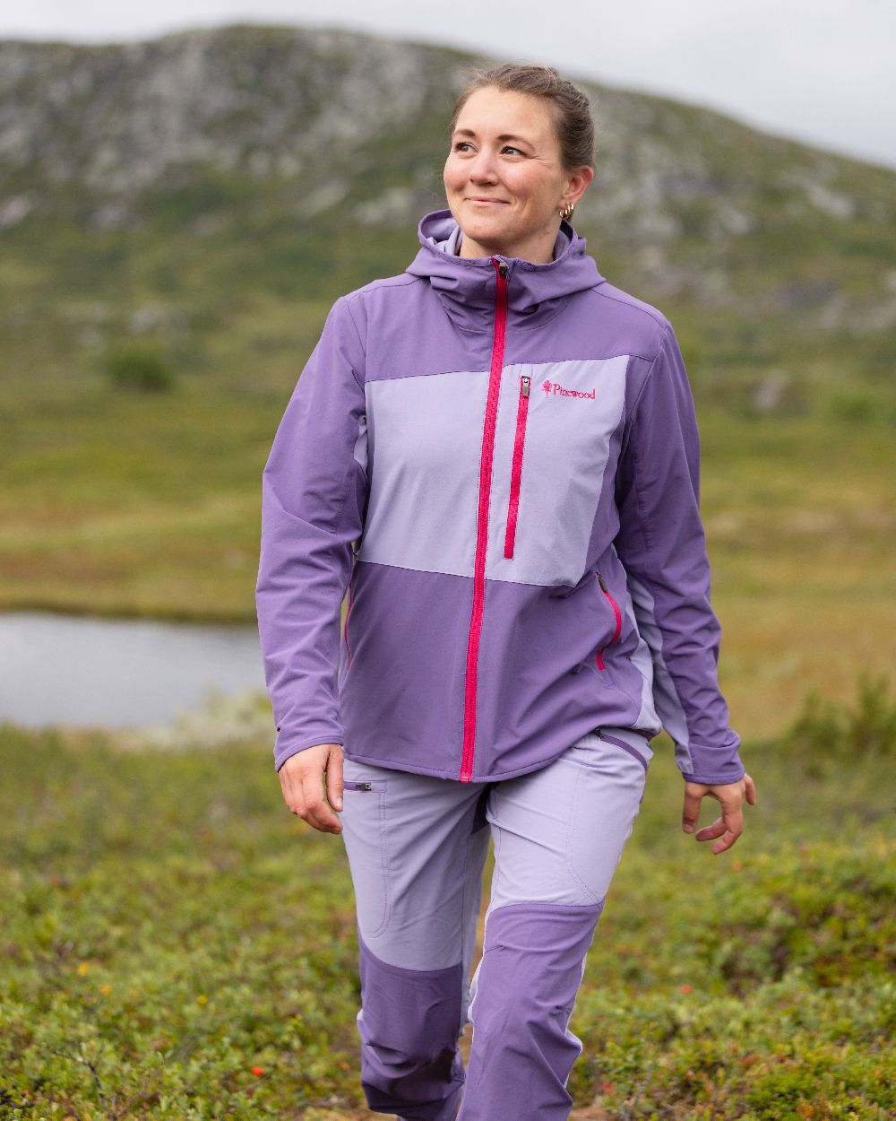 Light Lilac Coloured Pinewood Womens Abisko Light Stretch Jacket on outdoor background #colour_light-lilac