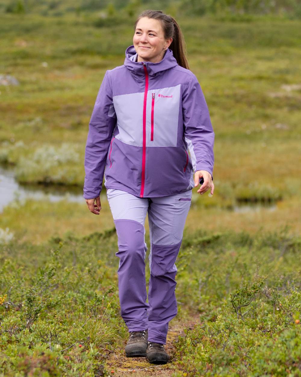 Light Lilac Coloured Pinewood Womens Abisko Light Stretch Jacket on outdoor background #colour_light-lilac